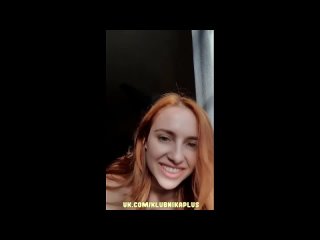 redhead shakes her tits.